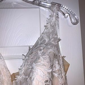 beautiful, new, not used, wedding dress. chest size is 34B .Dress is a size 4